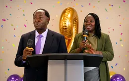 Good Hands leaders speaking at a podium