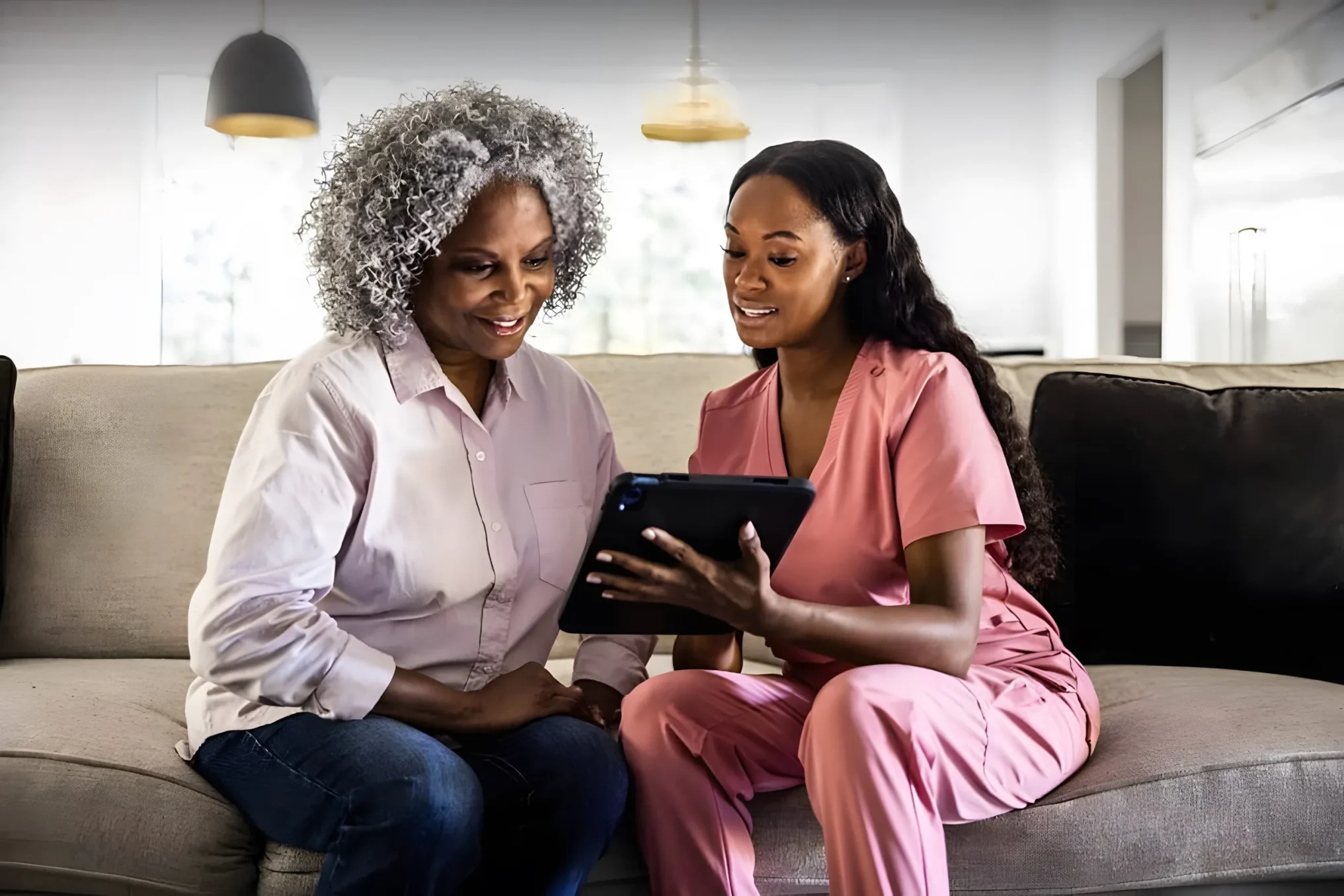 Home health care professional reviewing care plan